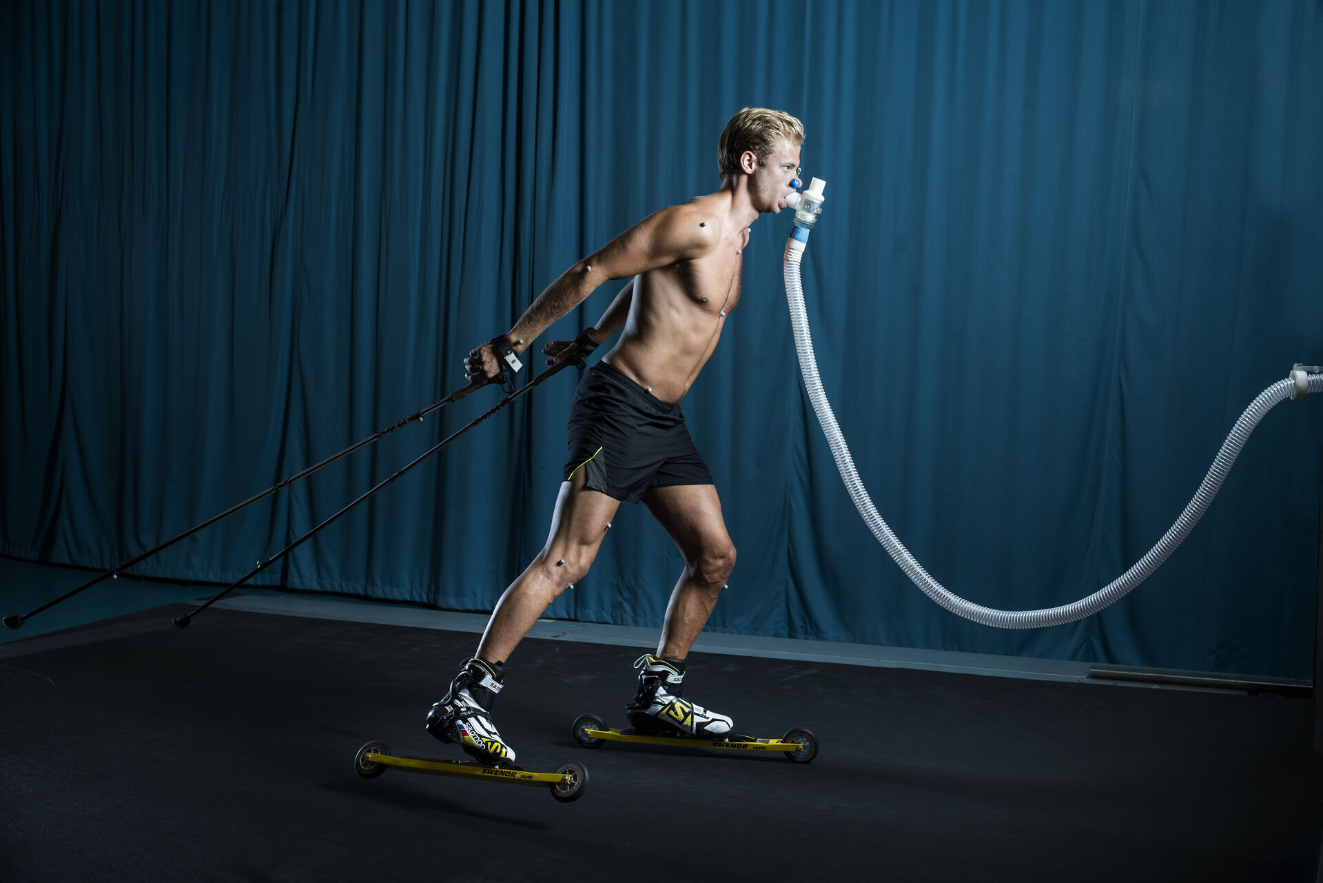 Man rollerskiing on treadmill