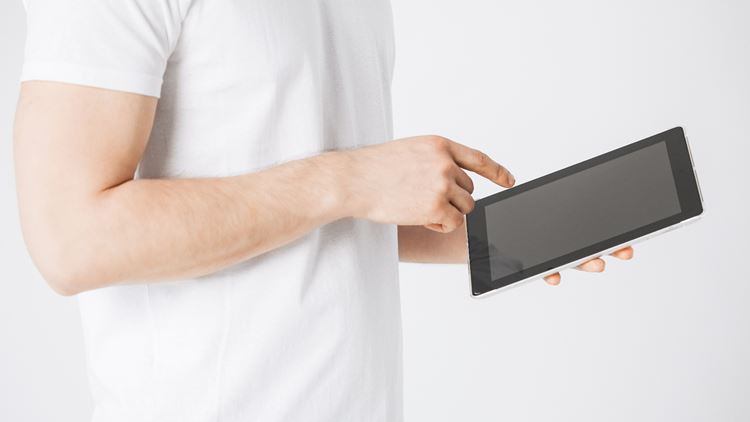 Image may contain: Hand, Tablet computer, Sleeve, Mobile phone, Gesture.