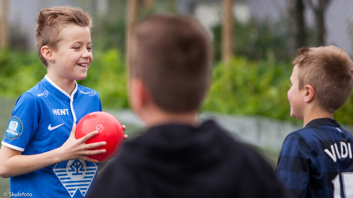 Kids playing ball outdoors