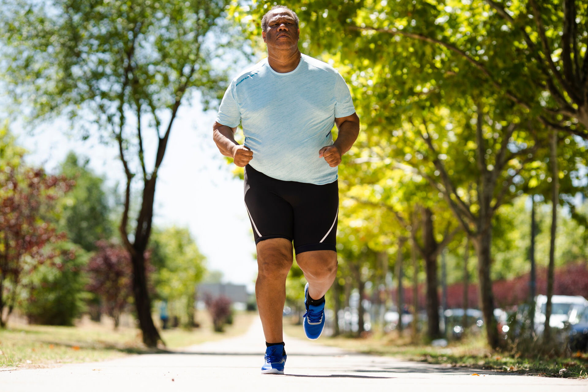 Overweight man jogging