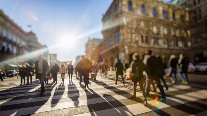 Crowd crossing street on foot