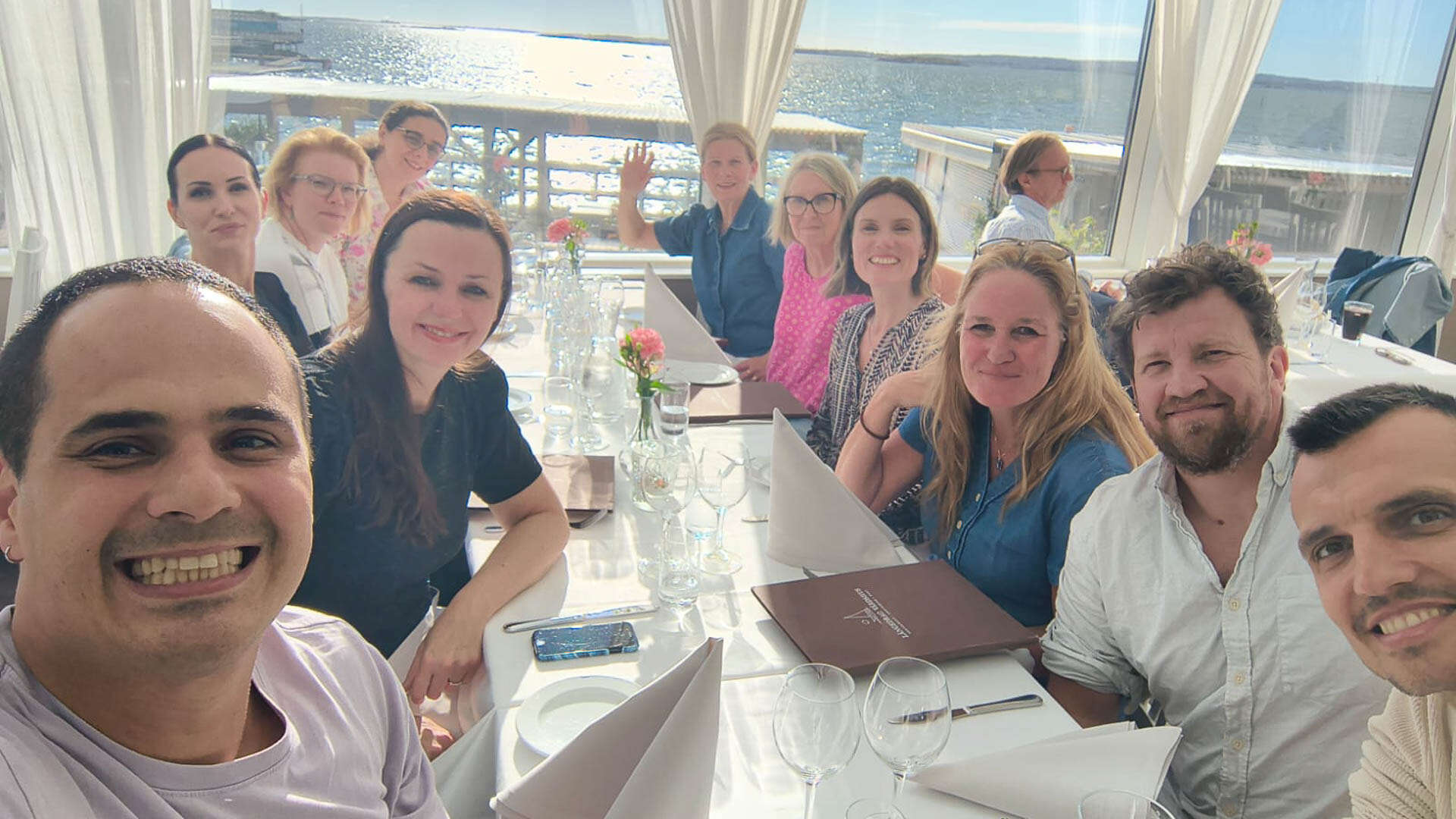 A group of people dining at a restaurant. 