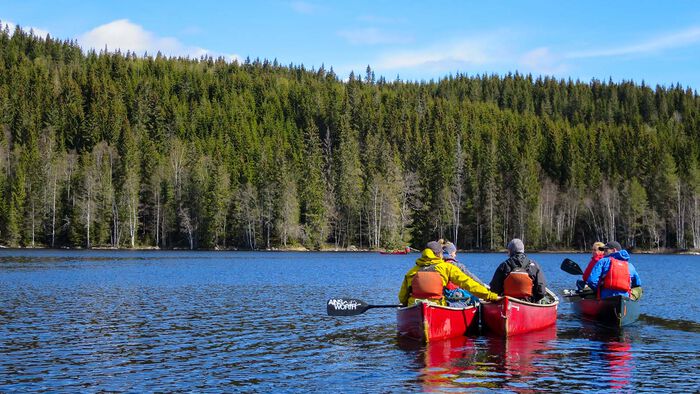 Students in canoe on a lake