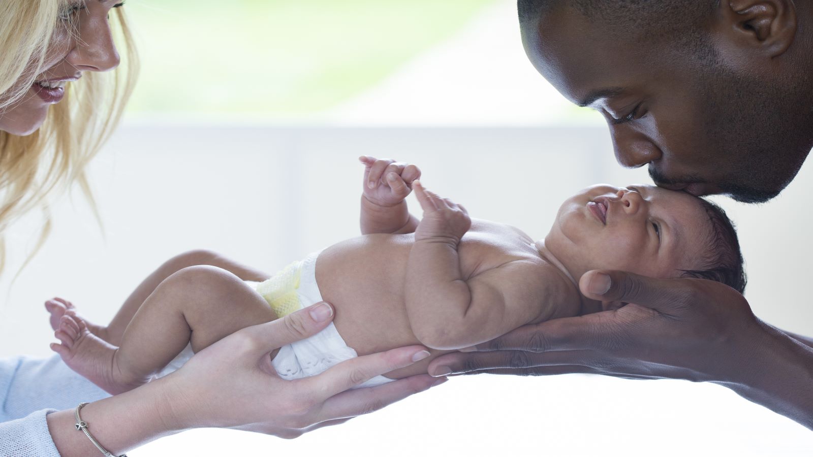 A newborn child with parents
