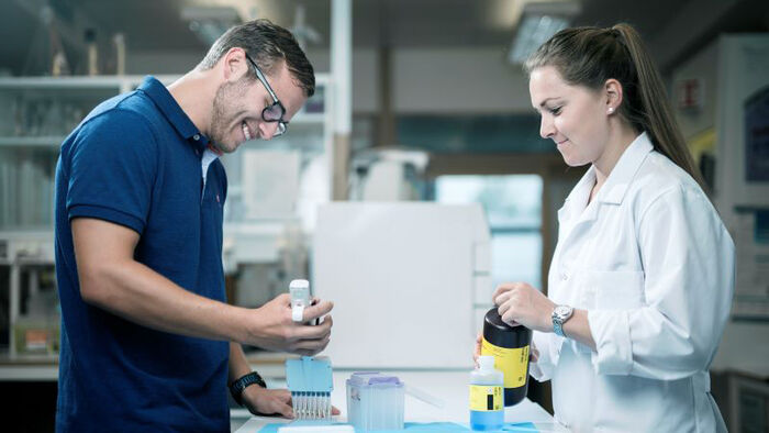 Student and engineer working in the lab