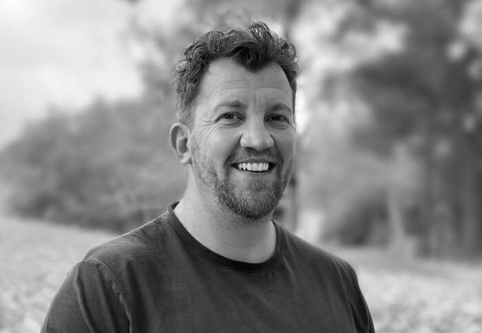 Profilbilde av James Ruud som smiler