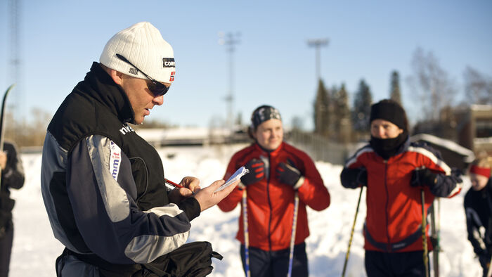 Winter at NIH, cross country athletes with trainer.