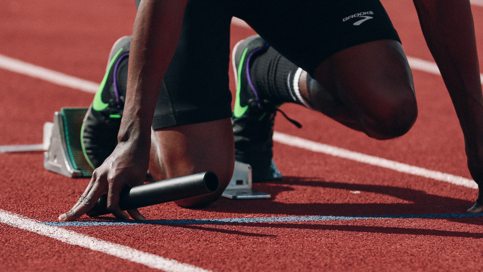 A sprinter positioned in the starting block
