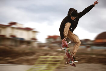 Young man skating on concrete